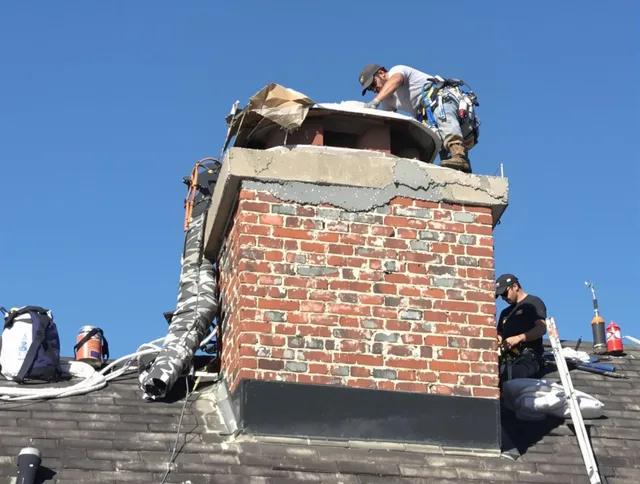 Windsor Chimney Sweep installing a custom chimney crown in Windsor, CT