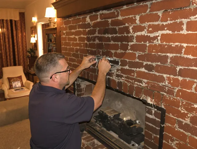 Windsor Chimney Sweep expert fixing a fireplace in Windsor, CT